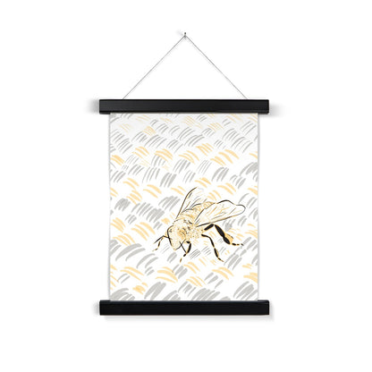  a black wooden poster hanger. The print: a digital line drawing of a bee. The background is white, the bee is rendered in black/yellow, and the rug in grey/yellow. 