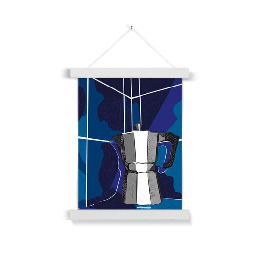 A white wooden poster hanger. The print: A grey moka pot is sitting on a bench and it is rendered in grey/black/white with doodle accents. The background is in blues, with white lines that indicate they are tiles, and squiggle accents.